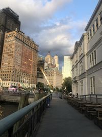 Street amidst buildings in city against sky