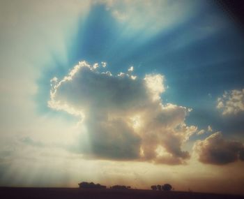 Scenic view of landscape against cloudy sky