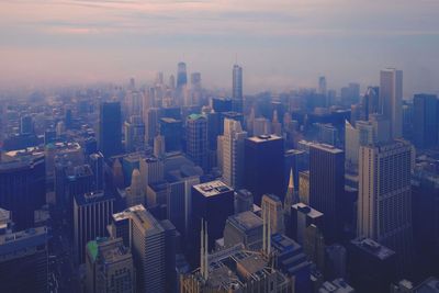 High angle view of buildings in city against sky