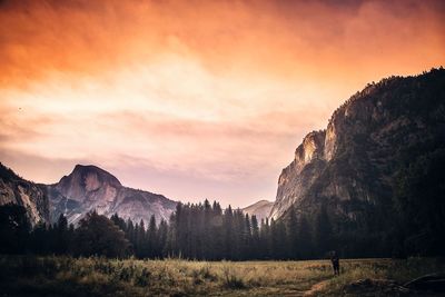 Scenic view of mountains against sky at sunset