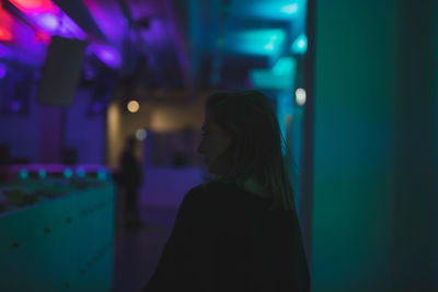 Young woman standing in restaurant