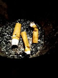 Close-up of cigarette smoking on table