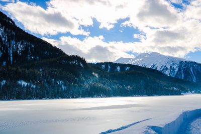 Scenic view of mountains against sky during winter