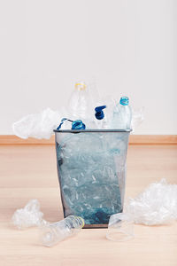 Close-up of garbage in bin on floor