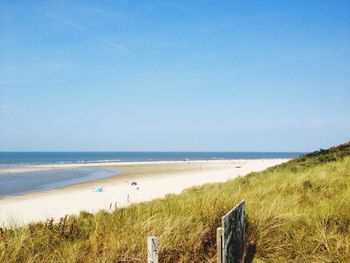 Scenic view of beach and sea against sky