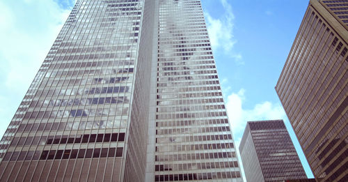 Low angle view of modern buildings against sky