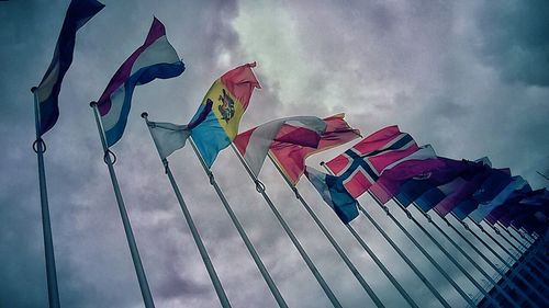 Low angle view of colorful umbrellas against sky