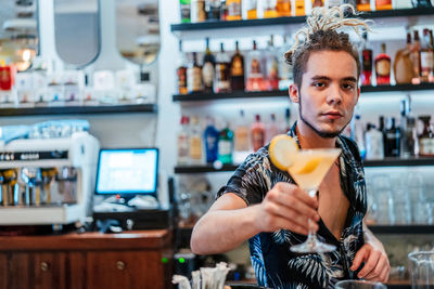 Portrait of young man holding ice cream