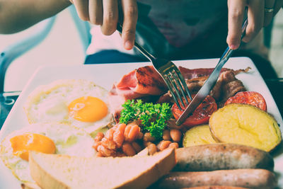 Close-up of man preparing food