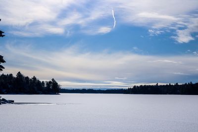 Scenic view of snow field against sky