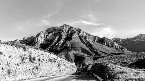 Scenic view of mountain road against sky