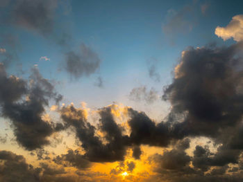 Low angle view of dramatic sky during sunset
