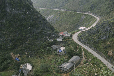 High angle view of road amidst trees