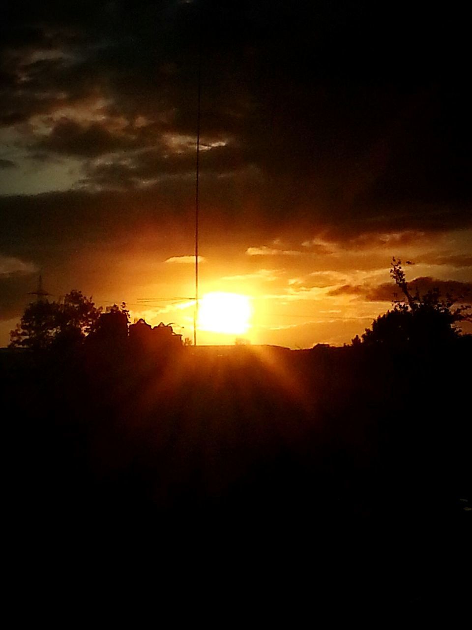 sunset, sun, silhouette, sky, power line, electricity pylon, cloud - sky, sunlight, sunbeam, tranquility, tree, beauty in nature, scenics, tranquil scene, electricity, nature, power supply, lens flare, cable, cloud