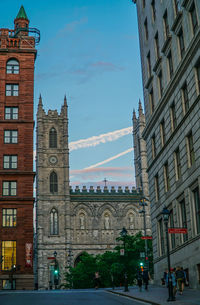 View of buildings in city against sky