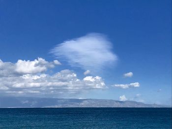 Scenic view of sea against blue sky