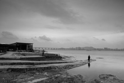 Man on beach against sky