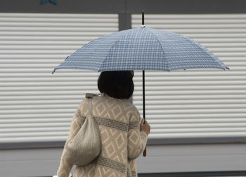 An umbrella as a protection against rain on the outside