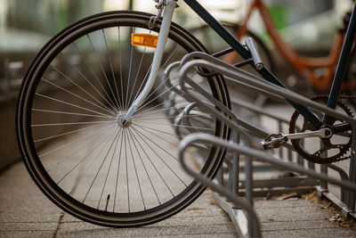 Close-up of bicycle parked on street