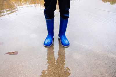 Low section of person standing on street