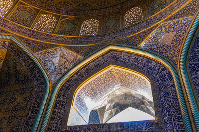 Low angle view of ornate ceiling in historic building