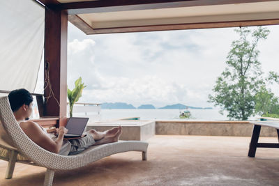 Man sitting on table at home