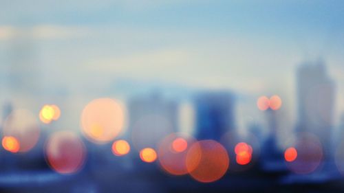 Defocused image of illuminated city at night