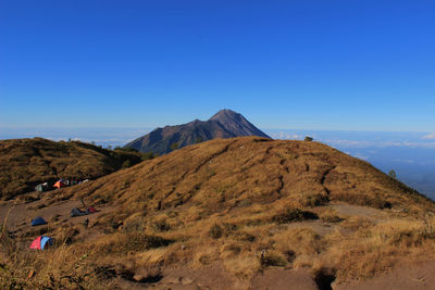 Scenic view of mountains against clear blue sky