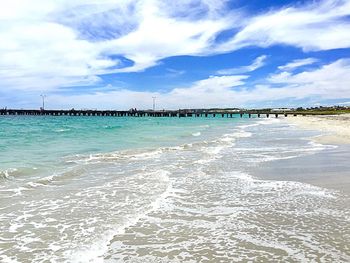 Scenic view of sea against cloudy sky