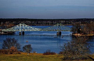 Bridge over river against sky