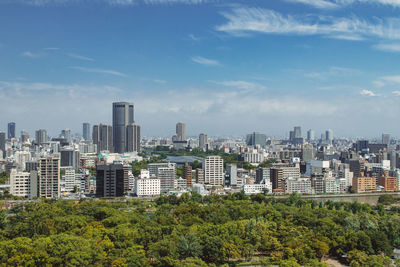 Buildings in city against sky