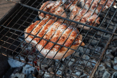 Close-up of meat on barbecue grill