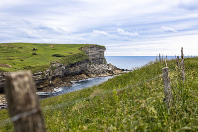 Scenic view of land against sky