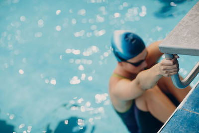 High angle view of man swimming in pool