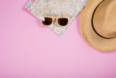 High angle view of sunglasses in hat