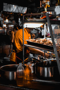 Man working in kitchen at restaurant