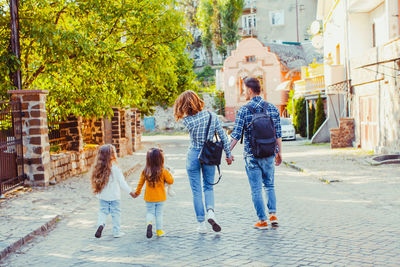 People walking on street in city