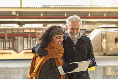 Mature couple using digital tablet