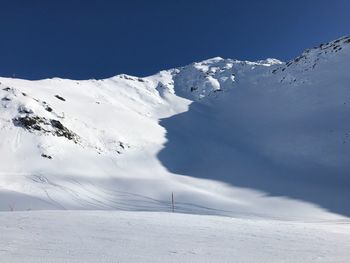 Snow covered mountains against sky