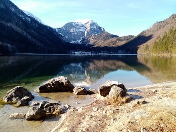 Scenic view of lake and mountains against sky