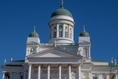 Low angle view of building against blue sky