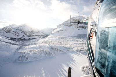 Panoramic view of mountains against sky during winter