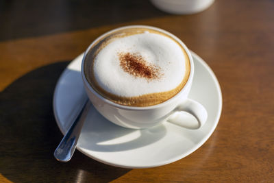 High angle view of coffee cup on table