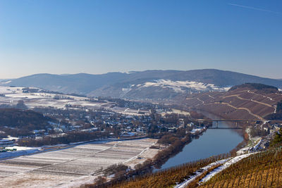 View on the valley of the river moselle, germany in winter with snow