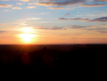 Scenic view of silhouette landscape against sky during sunset