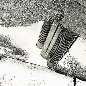 Close-up of puddle on sand