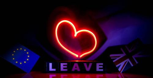 Close-up of illuminated heart shape against black background