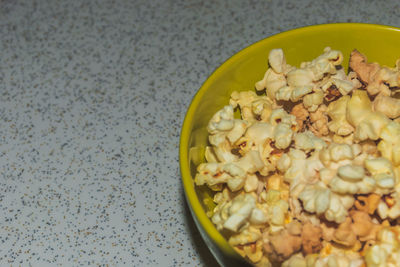 High angle view of green peas in bowl on table