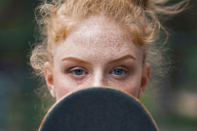 Close-up portrait of a serious young woman