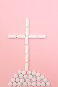 Directly above shot of electric lamp against pink background